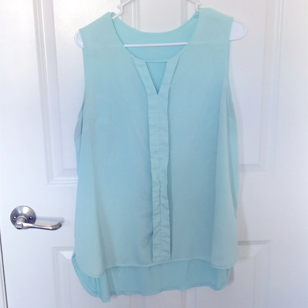 Light teal sleeveless blouse